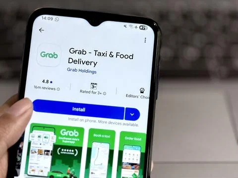 Grab Application on Mobile Phone Stock Photos