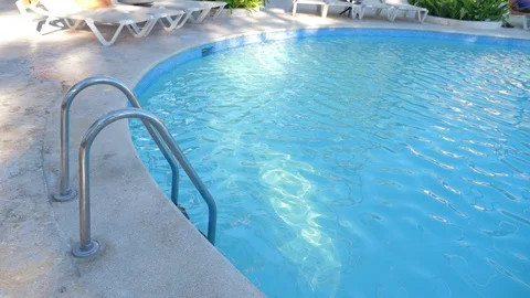 Grab bars ladder in swimming pool Stock Footage 101065941