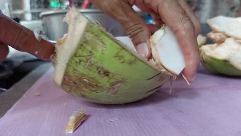 Grab some coconut meat Stockbeeldmateriaal 261177104