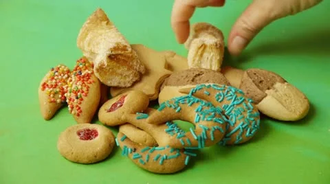 Grabbing Assorted Cookies Stock Footage 16452139
