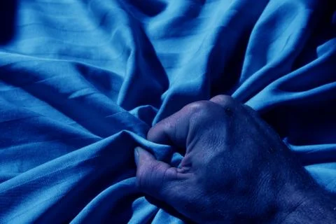 Grabbing bed sheet Stock Photos