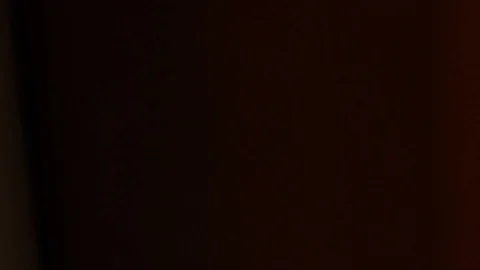 Grabbing a camera from a shelf Stock Footage 107325661