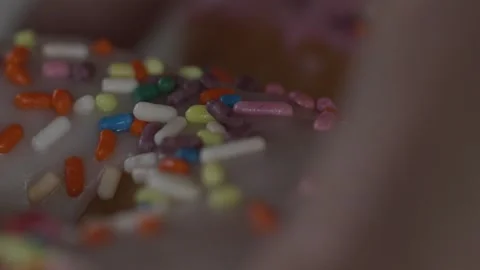 Grabbing A Donut Macro Stock Footage 281023806