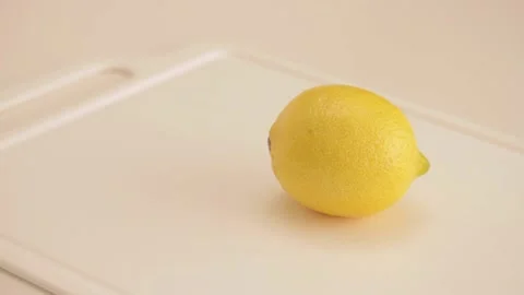 Grabbing a lemon Stock Footage 133813197