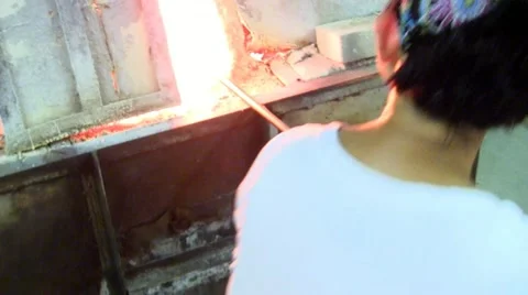 Grabbing molten gather Stock Footage 12332834