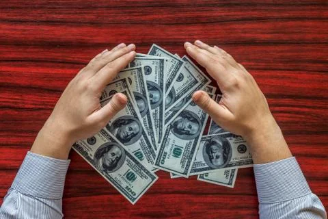 Grabbing money Stock Photos