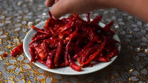 Grabbing red dried chilli Stock Footage 332688865