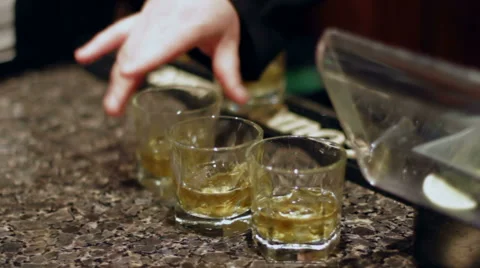 Grabbing Shots of Whiskey Stock Footage 45937382