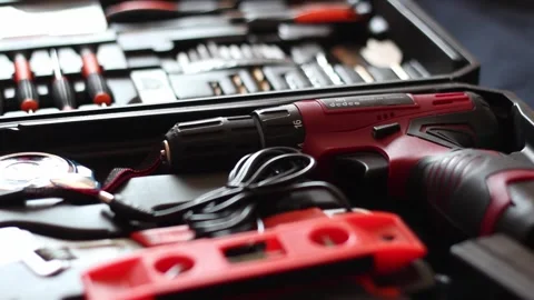 Grabbing taking the power drill from the tool kit. Stock Footage 242537685