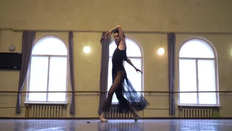 Graceful ballerina dancing elements of classical ballet in the dance studio Stock Footage 270502551