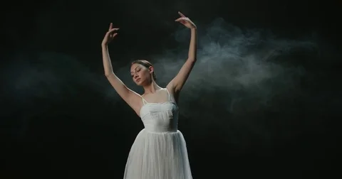 Graceful ballerina during the training in the Studio. Smoke, fog, slow motion Video stock 85044260