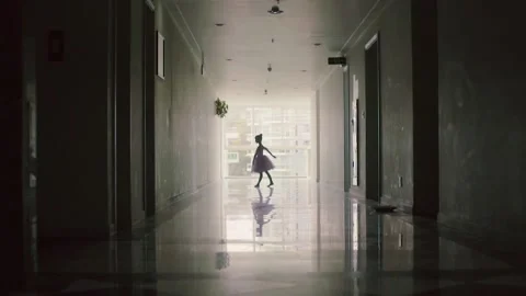 Graceful Ballet-dancer Dancing Classical Ballet Along Dark Hallway. Stock Footage 145311966