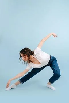 Graceful contemporary dancer making deep artistic bow, leg put forward. Stock Photos
