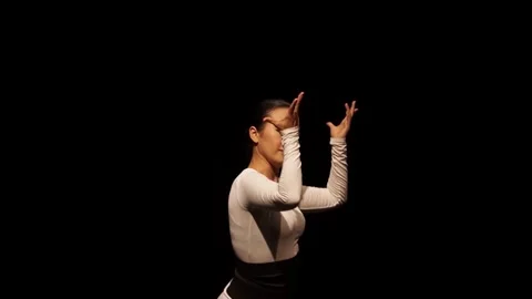 Graceful Dancer in Dramatic Lighting Stock Footage 313354868