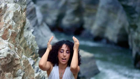 A graceful dancer surrounded by nature, showcasing expressive movements and Stock Footage 318059102