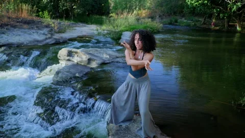 A graceful expression of joy and freedom, as a woman extends her arm skyward Stock Footage 314305431