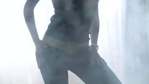 Graceful female dances in the backlight with smoke. Stock Footage 239226647
