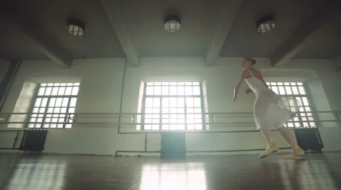Graceful girl practicing ballet in the Studio, slow motion , does pirouettes Stock Footage 56749465