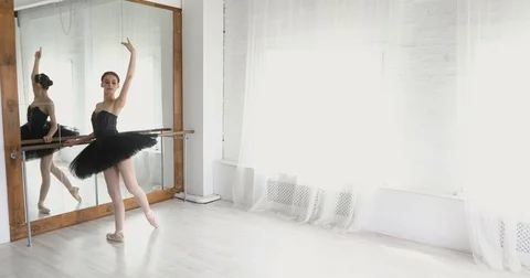 Graceful girl practicing ballet in the Studio Stock Footage 75131315
