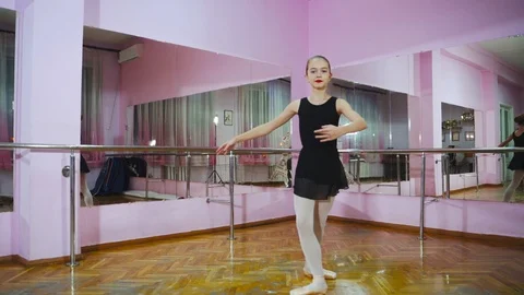 Graceful girl practicing ballet in the Studio. Performs the elements of dance. Video stock 101455082
