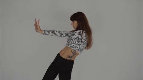 Graceful girl practicing contemp in studio, she performing the elements of dance Stock Footage 70787660