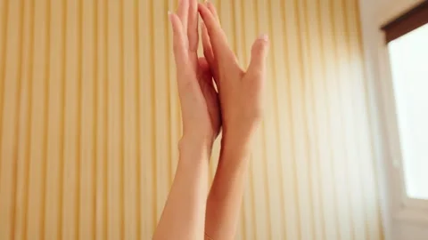 Graceful Hand Movements in Soft Light Stock Footage 337711678