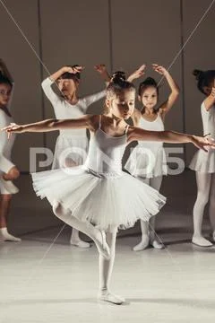 Graceful kid girl ballerina with friends ballet dancers Stock Image ...