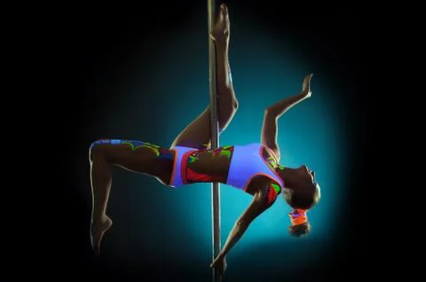 Graceful pole dancer with UV pattern on body Stock Photos
