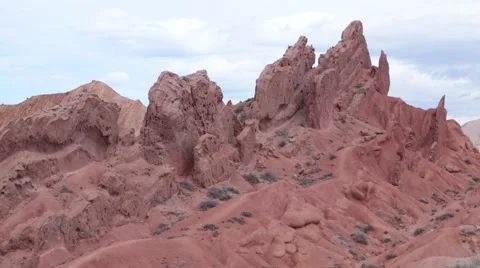 Graceful red rocks in the main canyon, Konorchek, Kyrgyzstan Stock Footage 63612552