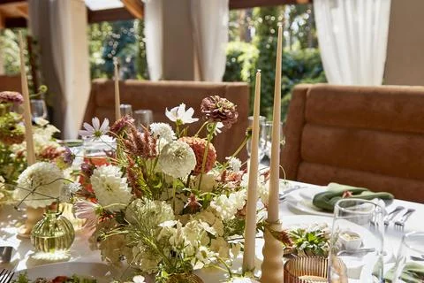 Graceful setup of chambers table, featuring a tasteful interplay of candles and Stock Photos