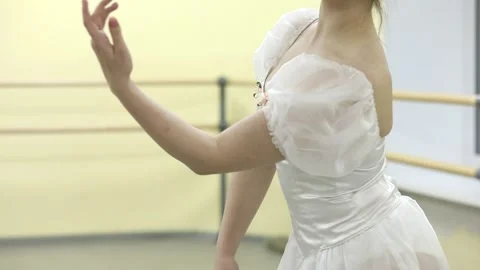 Graceful young ballerina dancing elements of classical ballet Stock Footage 148233208