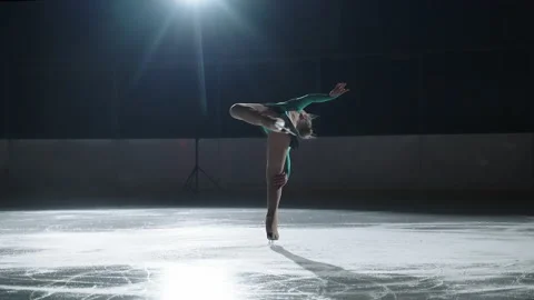 Graceful young woman performs the basic elements of figure skating, spin Stock Footage 155274144