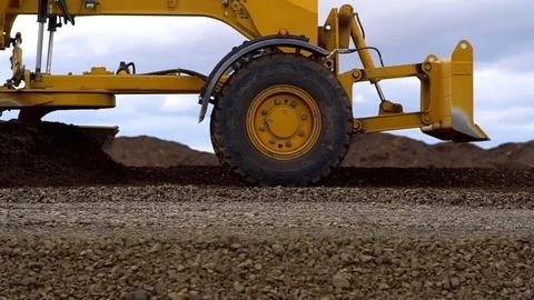 Grader aligns and lays the ground on the road. Stock Footage 100008219