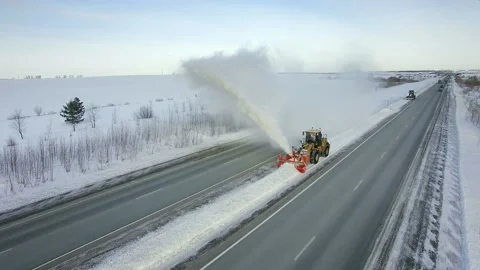 Grader clean remove snow, snowplow, snow blower, blast snowfall, winter, road Stock Footage 85684372