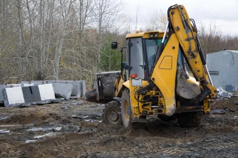 Grader clearing and leveling construction site surface. Grader industrial mac Stock Photos