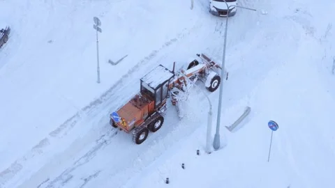 Grader clearing snow from a road Stock Footage 287600997