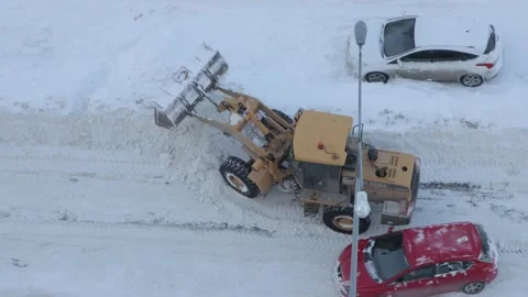 Grader clearing snow from a road Stock Footage 287601248