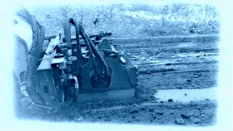 Grader Cuts Asphalt On Old Road On The Side View At Blue Footage Stock Footage 91965367