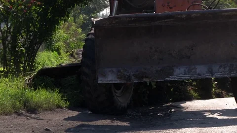 A grader cuts a layer of soil Stock Footage 115018441