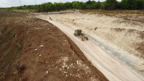 The grader is driving down the road Stock Footage 170929554