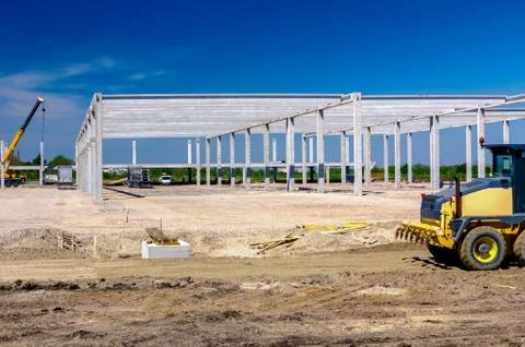 Grader is leveling ground at construction site Stock Photos