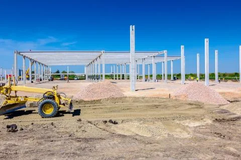 Grader is leveling ground at construction site Stock Photos
