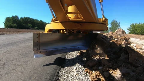 Grader levels bulk building materials for construction new road Stock Footage 159090454