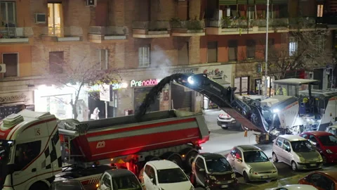Grader machine and dump truck working on the road at night, grader grinding road Stock-Footage 163932312