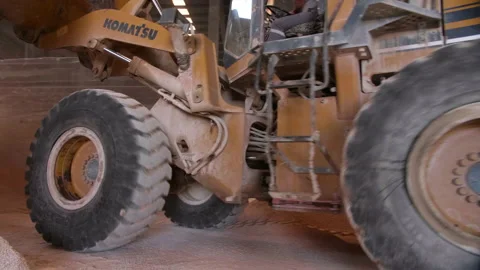 Grader Moving Clay Soil in Ceramic Factory Warehouse Stock Footage 166696951