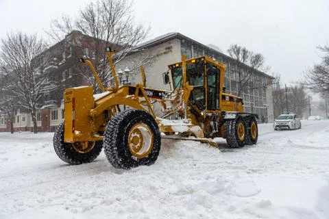 Grader Plowing snow Stock Photos