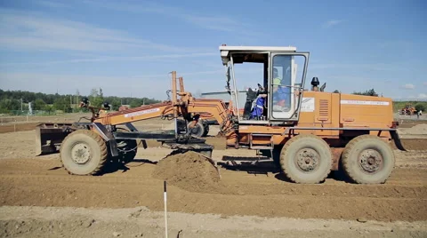 Grader road construction create a flat surface during the grading process Stock Footage 68146847