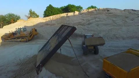 Grader scraper load grit material into the truck in canyon Drone 4K footage 스톡 동영상 120409056