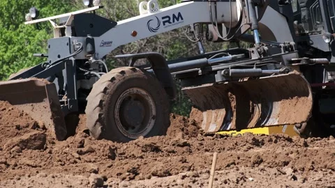 Grader working on road construction. Heavy Industrial Machines Build a Highway Stock Footage 130406923
