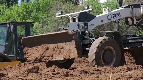 Grader working on road construction. Heavy Industrial Machines Build a Highway Stock Footage 130407076